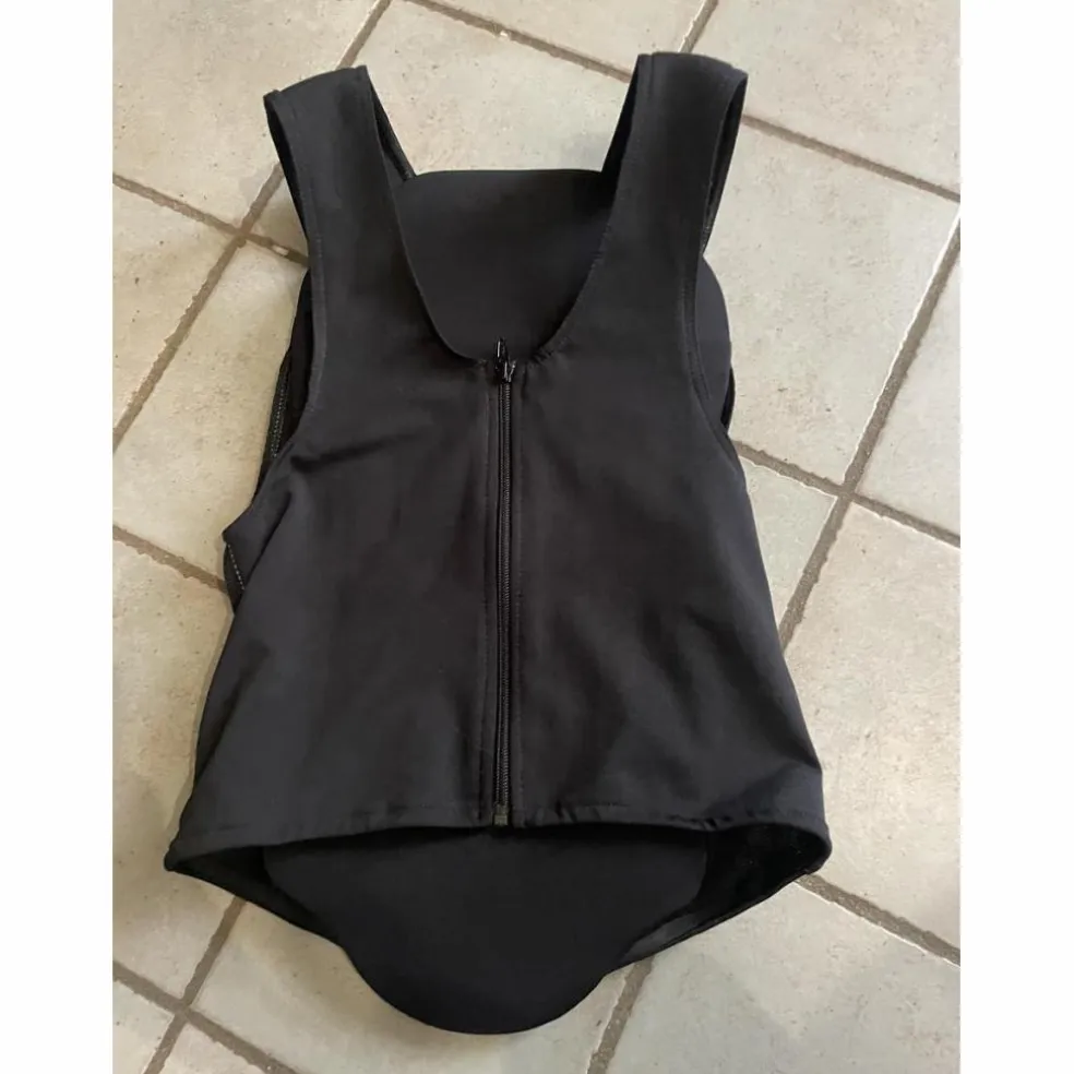 Protection dorsale comme neuve