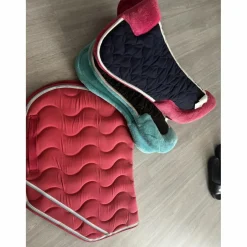 Tapis de selle et amortisseur